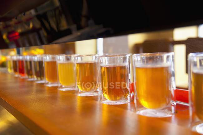 Glasses of different teas in row — Stock Photo