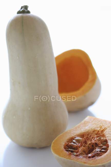 Butternut squash with halves — Stock Photo