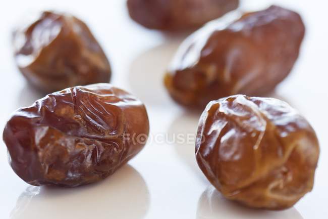 Dried dates on white — Stock Photo