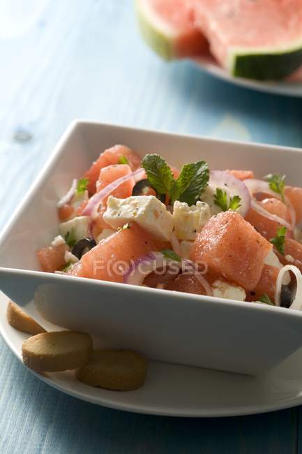 Salad with watermelon, brynza cheese and onion — Stock Photo