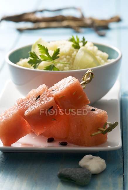 Cuscus with lemon and marinated watermelon slices — Stock Photo
