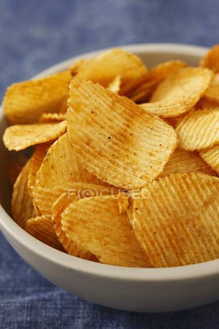 Potato crisps on the plate — Stock Photo