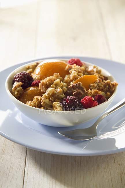 Muesli with apricots and raspberries — Stock Photo