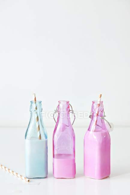 Strawberry shakes in bottles — Stock Photo