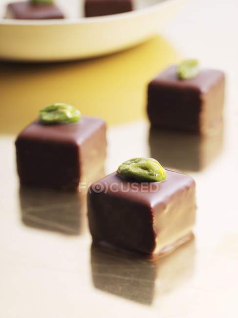 Filled chocolates with pistachios — Stock Photo