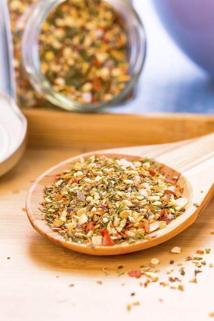 Closeup view of Bruschetta spice mix on a wooden spoon — Stock Photo