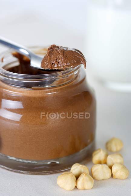 Chocolate spread on spoon — Stock Photo