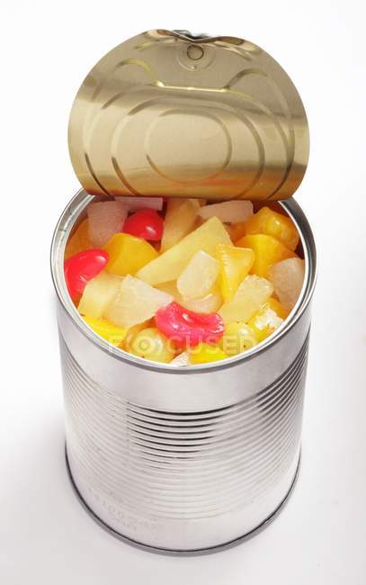 Fruit salad in opened tin — Stock Photo
