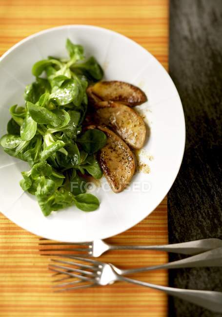 Lettuce with foie gras — Stock Photo