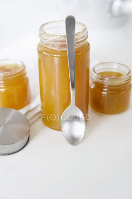 Apricot jam with ginger in jars — Stock Photo