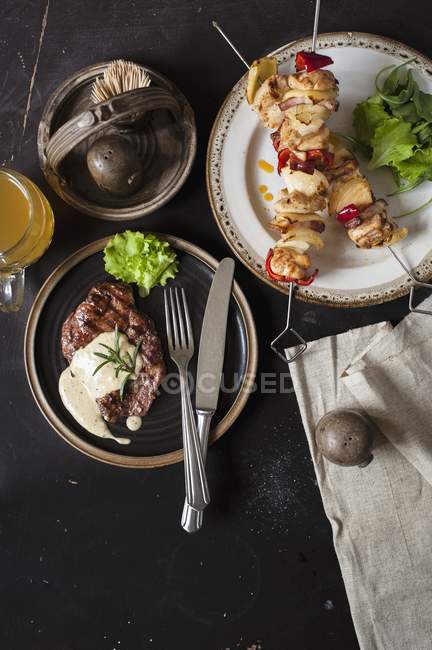 Grilled steak and skewers — Stock Photo