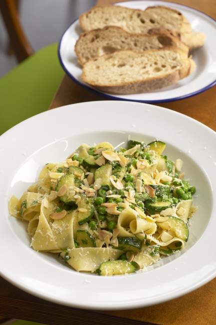 Pappardelle pasta with courgettes and peas — Stock Photo