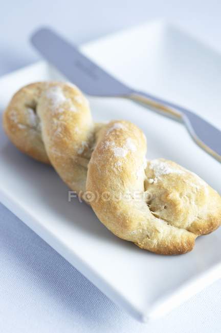 Twisted bread with flour — Stock Photo