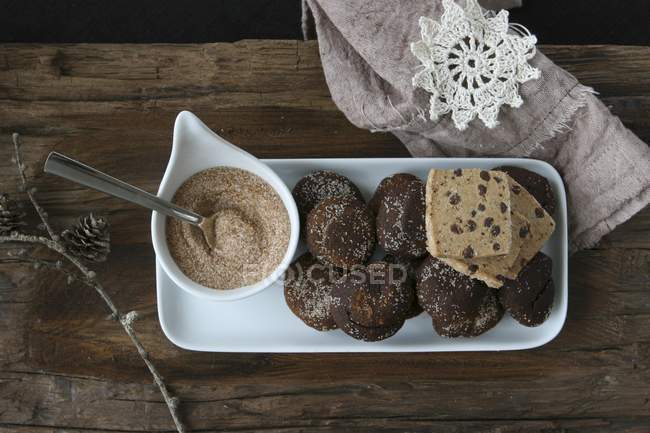 Top view of chocolate and cinnamon treats with brown sugar — Stock Photo