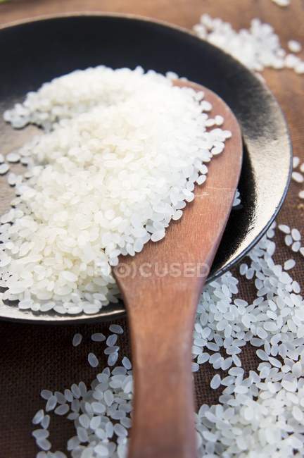 Bowl of uncooked rice — Stock Photo