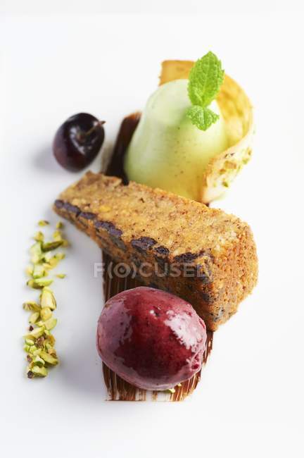 Hazelnut cake with cherry sorbet — Stock Photo