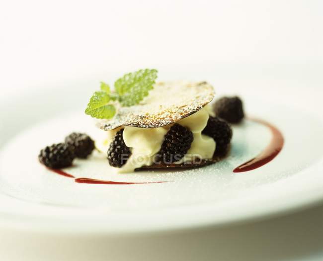 Closeup view of Mille-feuille with cream and blackberries — Stock Photo
