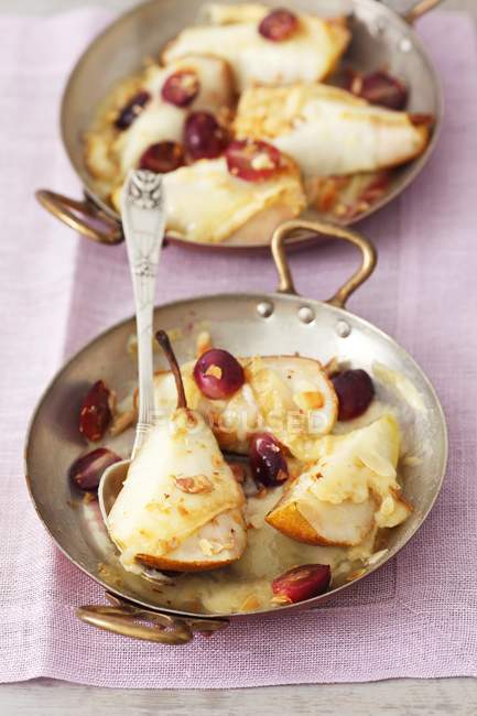 Pears topped with cheese — Stock Photo