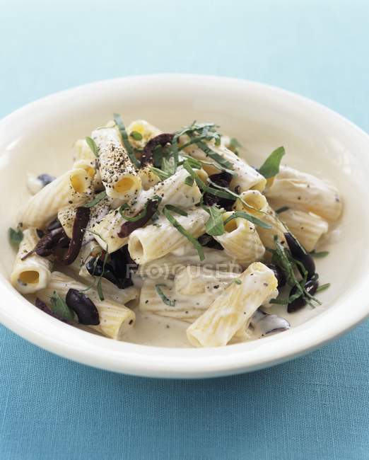 Rigatoni pasta with olives — Stock Photo