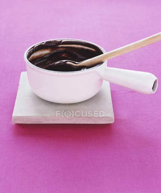 Melted chocolate in saucepan — Stock Photo
