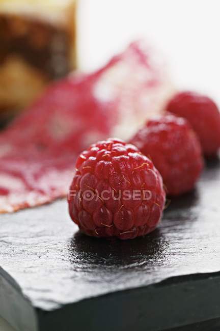 Raspberry dessert over desk — Stock Photo