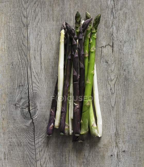 Purple with green and white asparagus — Stock Photo