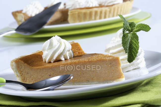 Pumpkin pie portion with whipped cream — Stock Photo