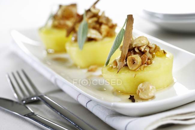 Poached apples with nuts — Stock Photo