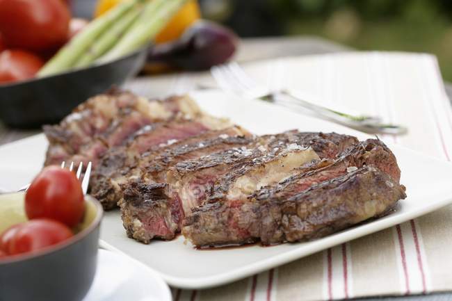 Sliced grilled beef steak — Stock Photo