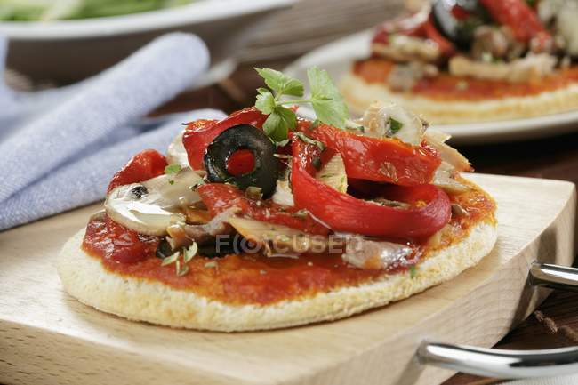 Mini pizza with peppers — Stock Photo