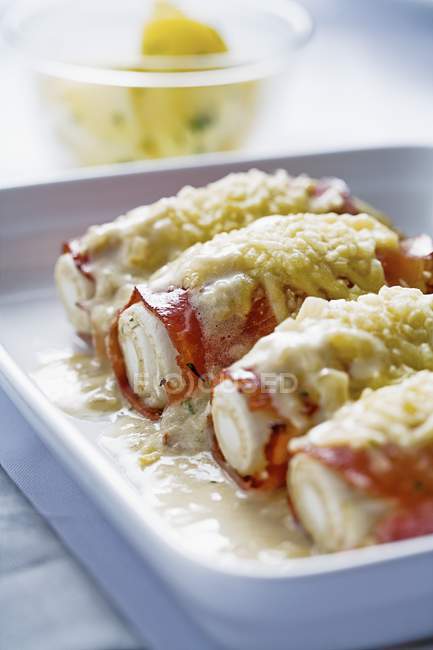 Gratinated chicory wrapped with ham — Stock Photo