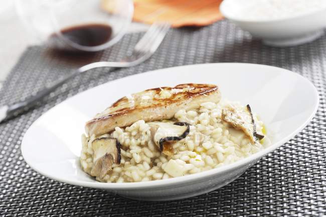 Closeup view of mushroom Risotto with goose liver — Stock Photo