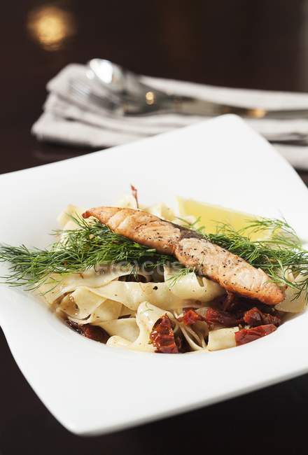 Tagliatelle ribbon pasta with salmon — Stock Photo