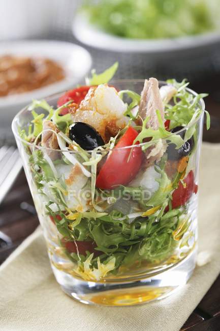 Frisee lettuce with tuna and cod — Stock Photo