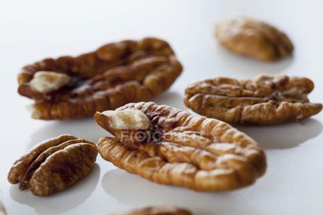 Pecan nuts on white — Stock Photo