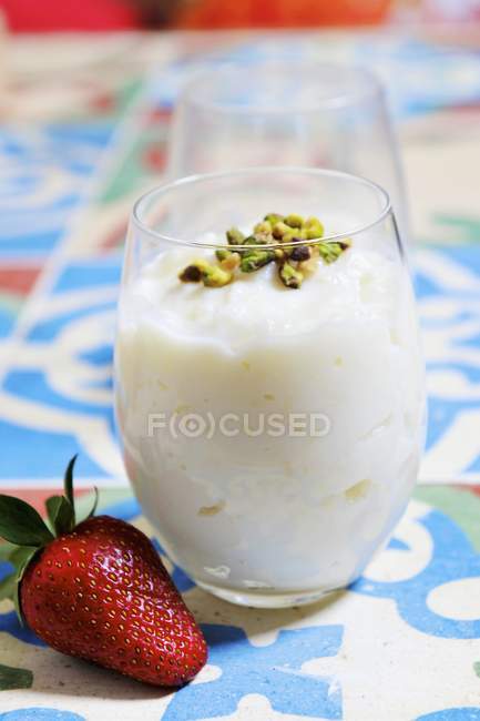 Rice pudding with pistachios — Stock Photo