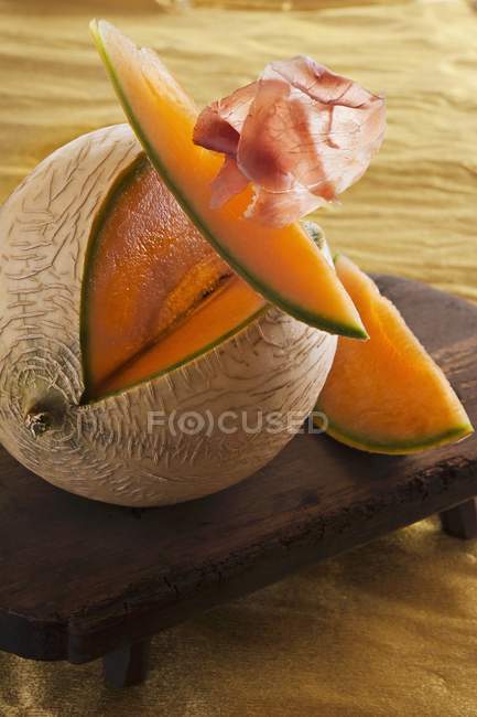 Cantaloupe melon with Parma ham — Stock Photo