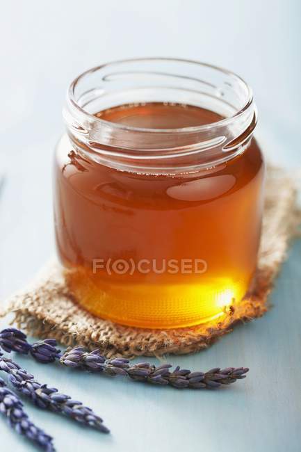 Jar of honey and lavender — Stock Photo