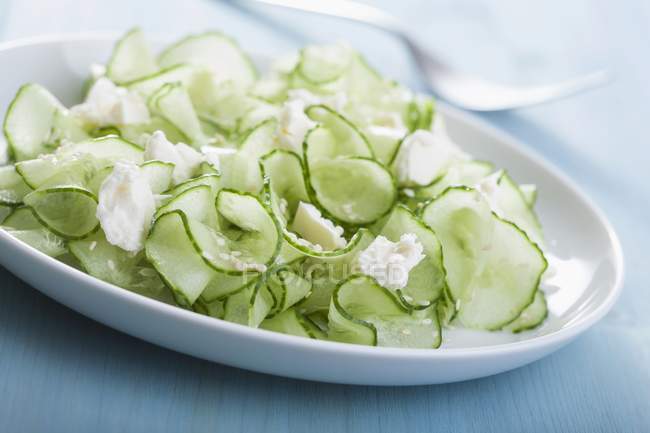 Cucumber salad with feta — Stock Photo