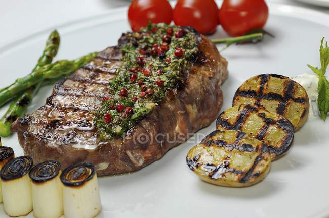 Grilled beef steak with herb butter — Stock Photo