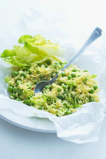 Green lemon couscous with peas — Stock Photo