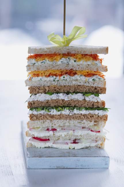 Stack of sandwiches on skewer — Stock Photo