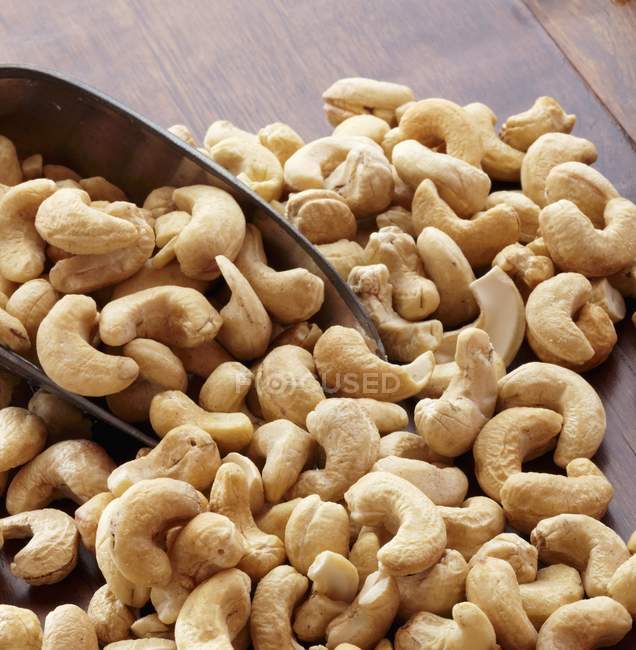 Cashews Spilling out of a Scoop — Stock Photo