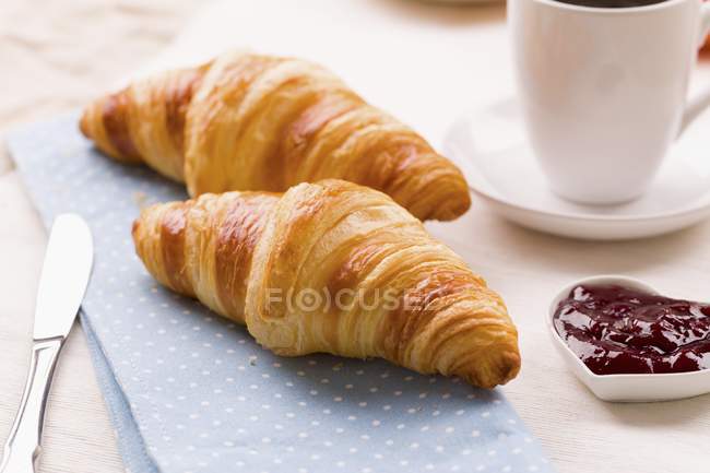 Croissants with raspberry jam — Stock Photo