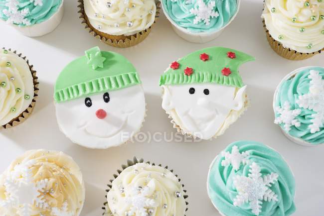 Cupcakes decorated with winter theme — Stock Photo