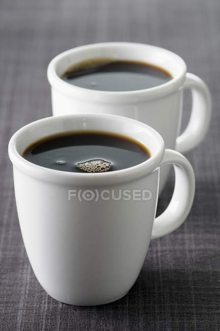 Cups of black coffee — Stock Photo