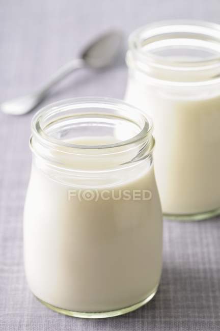 Natural yoghurt in jars — Stock Photo