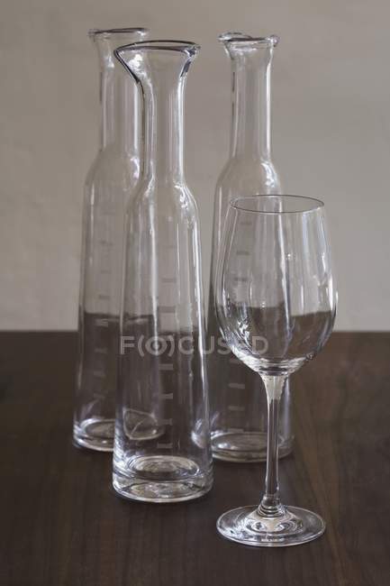 Closeup view of empty glassware on dark brown wooden surface — Stock Photo