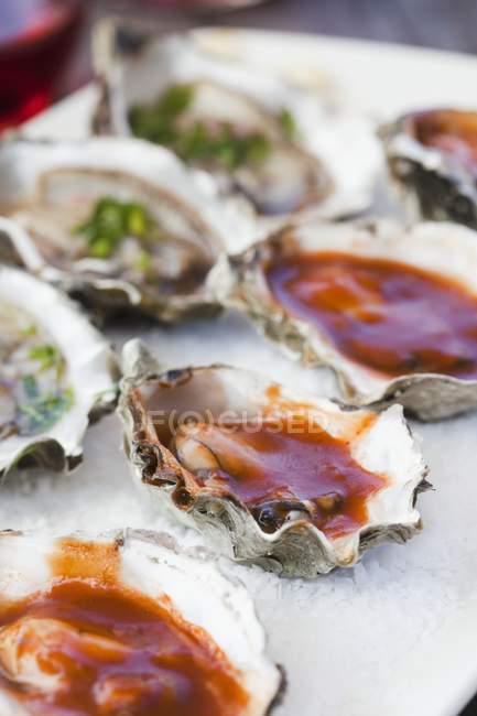 Barbecue and Fresh Oysters in shells — Stock Photo