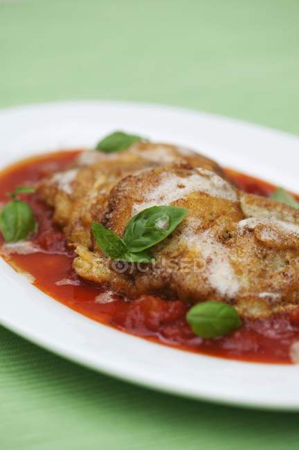 Piccata milanese with basil — Stock Photo
